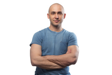 Wall Mural - Image of young bald man with arms crossed in blue tee shirt