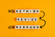 Business Branding Concept Of Rethink Revise And Rebrand Words On Wooden Cubes With Process Arrows