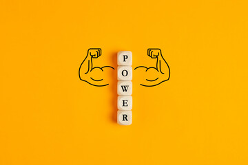 the word power on wooden cubes with hand drawn muscle arms. concept of power or powerful in business