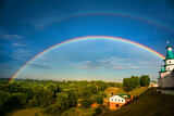Fototapeta Tęcza - Rainbow over the forest after the rain