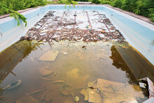 Abandon Public Swimming Pool In Asia, Garbage In Old Pool, Water Pollution, Dirty And Dangerous Environment, Outdoor Day Light