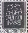 GERMANY, Berlin - CIRCA 1953: a postage stamp from Germany, Berlin showing bound hands break the chains and inscription June 17th. Memory of the June 17, 1953 uprising. color: black.
