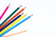 © FinestWebGeek - Six different colored wood pencil crayons scattered on a white background