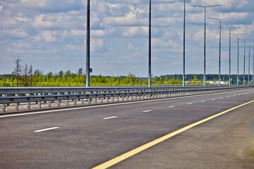 Modern highway infrastructure. Transportation road system. Highway flat asphalt surface. Highway car drive. Traveling by car. Motorway system. Transportation business. Autobahn roads.