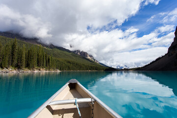Naklejka na meble turquoise lake and the nose of a canoe in summer
