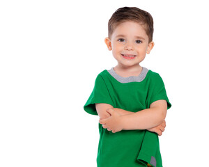 Portrait of a beautiful European boy 2 years old, the child is smiling, folded his hands under his chest. A beautiful and happy child. Isolated on a white background in a green t-shirt.