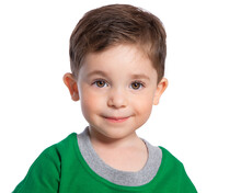 Portrait Of A Beautiful European Boy 2 Years Old. A Beautiful And Happy Child. A Child's Smile. Isolated On A White Background In A Green T-shirt.