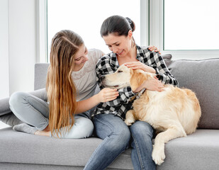 Wall Mural - Daughter and mother next to dog