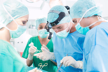 Wall Mural - Surgeons operating patient in operation theater