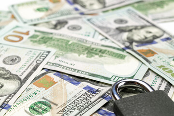 Save money concept. Washington American cash with padlock isolated on white. Usd money background.