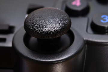 Poster - black game joystick on white background close-up