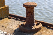 Rusty Anchor On The Pier