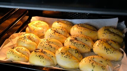 Wall Mural - freshly baked sesame buns at home,Cooked in the oven open sesame rolls, homemade pastries