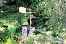 Home-made Weather Vane On Tree Stump With Succulents In South Australian Garden