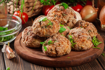 Wall Mural - Stack of baked meatballs on a chopping board