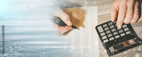 Fotomural Male hand using a calculator; panoramic banner