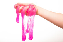 A Toy For Children Mucus And Liquid Flowing On Hand On A White Background