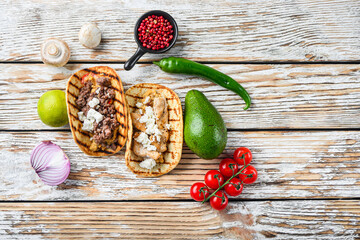 Wall Mural - Homemade taco with chicken and beef near raw ingredients over white textured old table, top view with space for text.