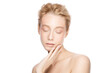 © Damir Khabirov - Beauty portrait of young beautiful blond woman face posing with closed eyes, touching her perfect skin, isolated on white background