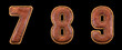 Set of numbers 7, 8, 9 made of leather. 3D render font with skin texture isolated on black background.