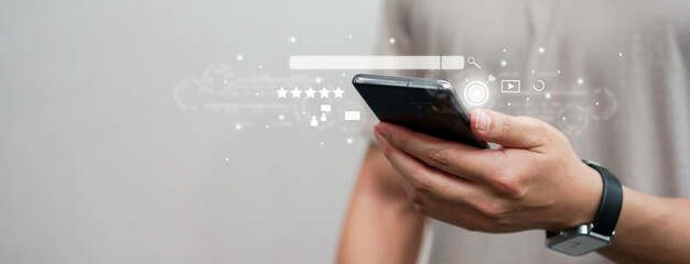 Wall Mural - close up man hand touchscreen on smartphone to use search engine optimization (seo) tools for find c