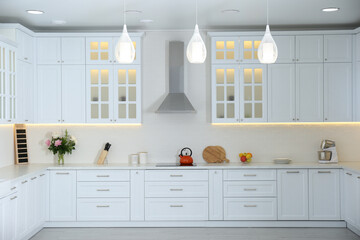 Wall Mural - Elegant interior of new kitchen with stylish furniture