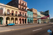 Havana, Cuba in February 2018. Traditional and colorful old cars with old buildings in the background.