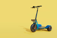 3d Rendering Of The Blue Three Wheels Electric Scooter On Pale Yellow Background.