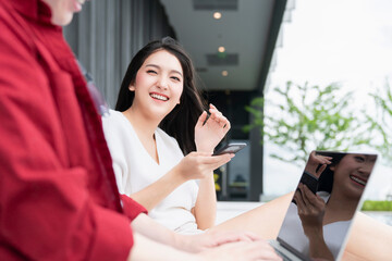 happiness cheerful asian young couple male and female eye contact laugh smile together fun conversation relax casual dress poll and garden  vacation weekend resort background