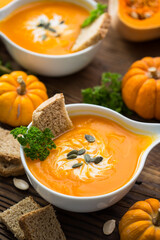 Wall Mural - Pumpkin soup with parsley and cream