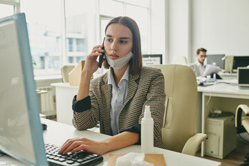 Poster - Serious businesswoman pushing keyboard key while looking at computer screen