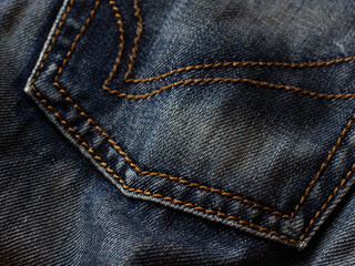 blue navy Jeans background, denim with seam of fashion design. macro close up