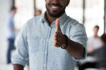 Friendly African HR manager extended his hand for handshake welcoming applicant new candidature for company position at job interview, boss greeting client or business partner concept close up image