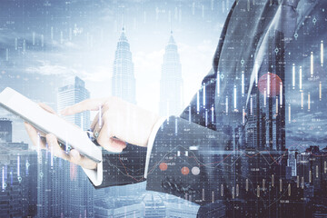 Poster - Businessman using tablet with creative business chart