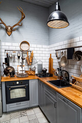 Wall Mural - kitchen in Scandinavian style. comfortable, practical interior. antlers on wall.