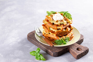 Wall Mural - Zucchini waffle, zucchini fritters cooking on waffle maker, vegetarian zucchini waffles with basil. Copy space