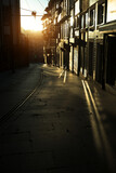 Fototapeta Uliczki - Narrow streets of the old city in the rays of a stunning dawn. Porto, Portugal.