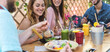 © Alessandro Biascioli - Happy friends lunching with healthy food in bar coffee brunch - Young people having fun eating meal and drinking smoothies fresh fruits in rustic restaurant - Health nutrition lifestyle concept