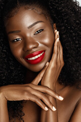Wall Mural - beautiful model with curly hair and perfect skin .clouse up beauty fashion portrait of african ameri