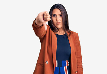 Sticker - Young beautiful brunette woman wearing elegant clothes looking unhappy and angry showing rejection and negative with thumbs down gesture. bad expression.