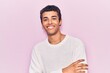 © Krakenimages.com - Young african amercian man wearing casual clothes happy face smiling with crossed arms looking at the camera. positive person.