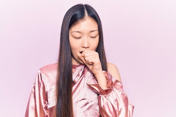 Sticker - Young beautiful chinese woman wearing casual shirt feeling unwell and coughing as symptom for cold or bronchitis. health care concept.