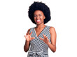 © Krakenimages.com - Young african american woman wearing casual clothes disgusted expression, displeased and fearful doing disgust face because aversion reaction. with hands raised