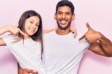 Sticker - Young father and daughter wearing casual clothes looking confident with smile on face, pointing oneself with fingers proud and happy.