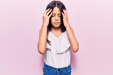 Canvas Print - Beautiful child girl wearing casual clothes with hand on head, headache because stress. suffering migraine.