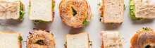 Flat Lay With Fresh Sandwiches And Bagels On Marble White Surface, Panoramic Shot