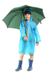 Wall Mural - Cute little boy in raincoat and with umbrella on white background