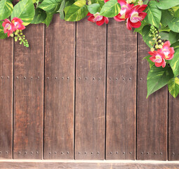 Wall Mural - Frame with wooden boards, flower and tropical leaves
