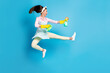 Full length body size view of her she nice attractive pretty funky funny comic childish cheerful maid jumping fighting infection dust isolated on bright vivid shine vibrant blue color background