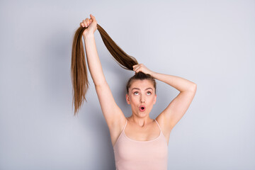 Canvas Print - Close-up portrait of her she nice attractive lovely cute cheerful funky brown-haired girl making ponytail medicine recovery solution isolated on light gray pastel color background